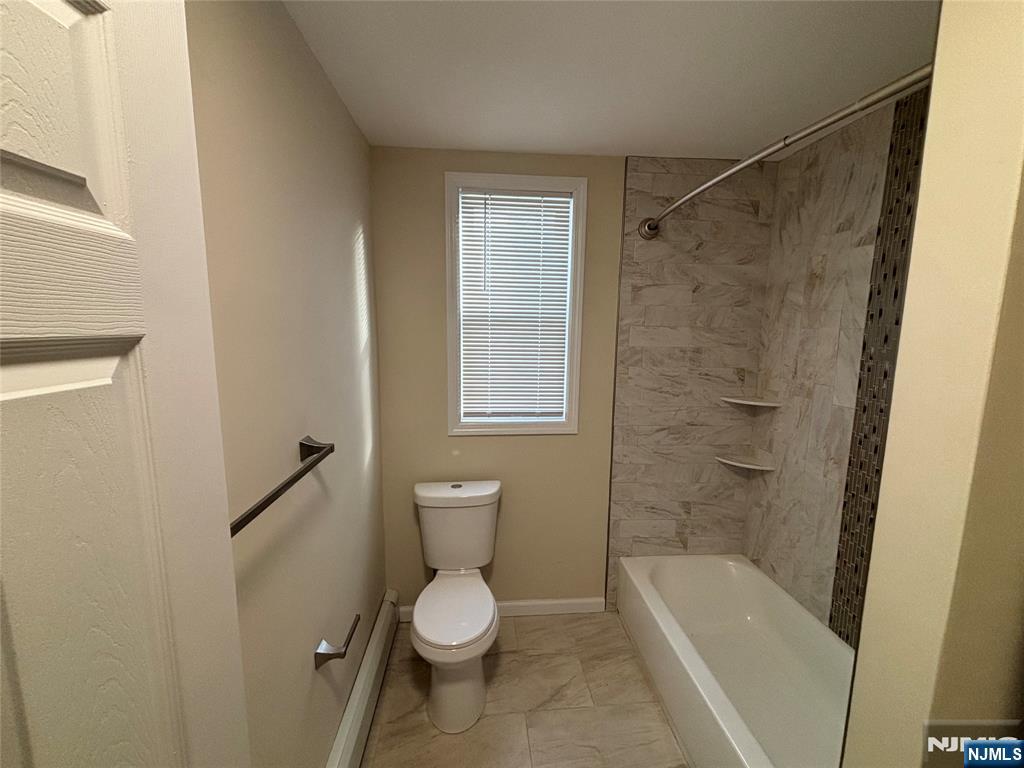 42 Maple Avenue, Unit 2 Irvington, NJ 07111 - Photo 6 of 10 a bathroom with a toilet a sink and shower