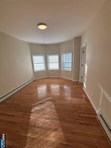 a view of livingroom with hardwood floor and window