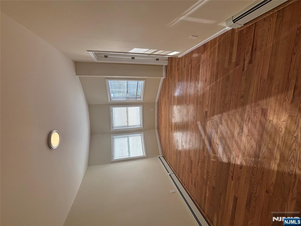 42 Maple Avenue, Unit 2 Irvington, NJ 07111 - Photo 9 of 10 a view of livingroom with hardwood floor and window