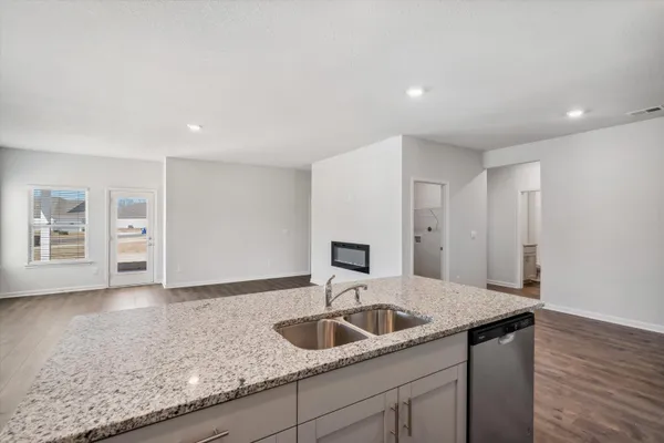 a kitchen with a sink and cabinets