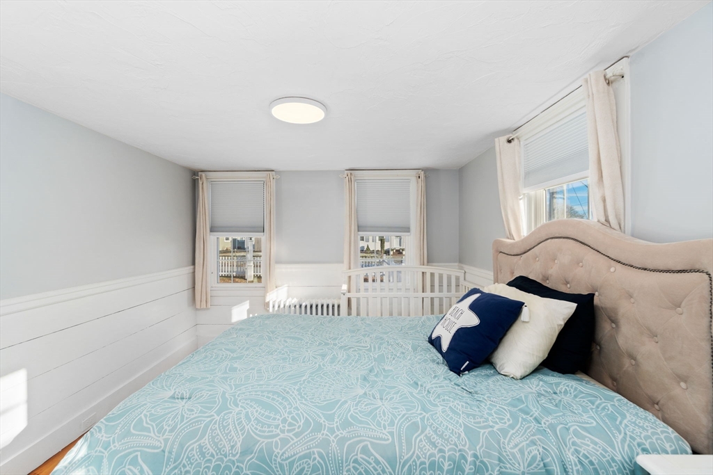 32 Woodside Avenue Wareham, MA 02532 - Photo 18 of 40 a spacious bedroom with a large bed and a window