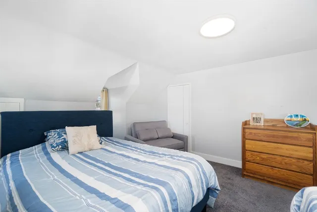 a bedroom with a bed and a closet