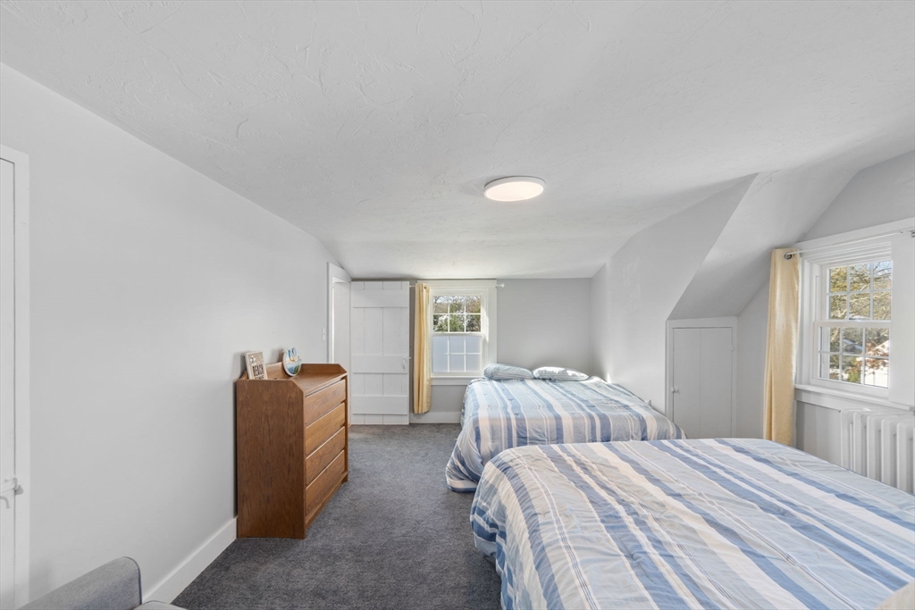 32 Woodside Avenue Wareham, MA 02532 - Photo 22 of 40 a bedroom with a bed and a cabinets