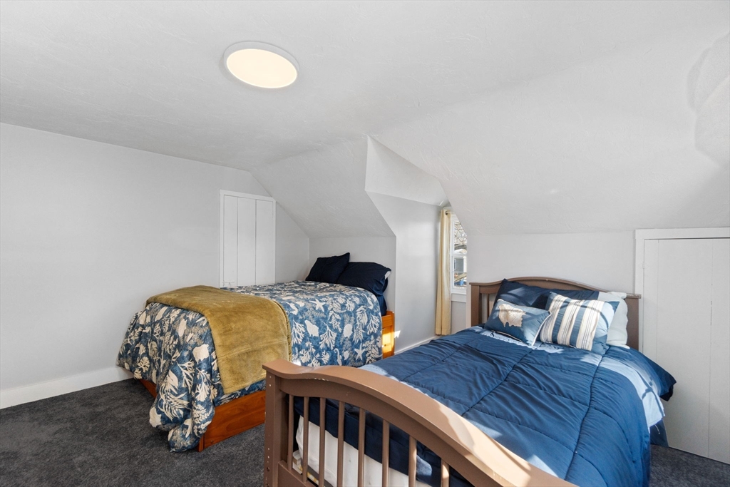 32 Woodside Avenue Wareham, MA 02532 - Photo 25 of 40 a bedroom with two beds and a lamp