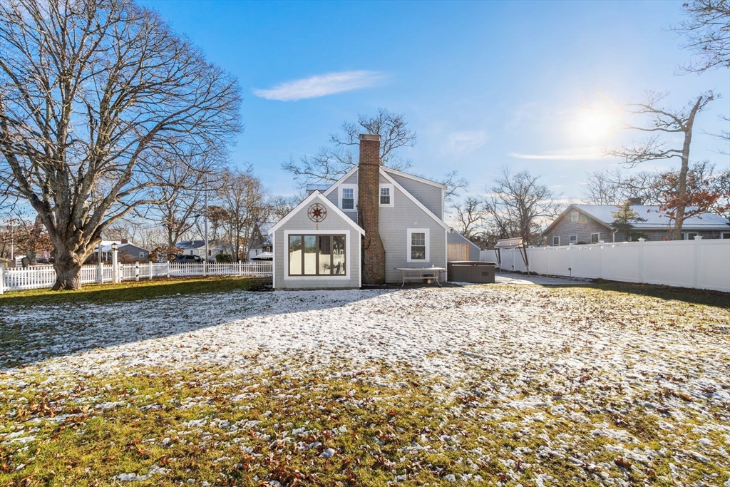 32 Woodside Avenue Wareham, MA 02532 - Photo 34 of 40 a front view of a house with a yard and garage