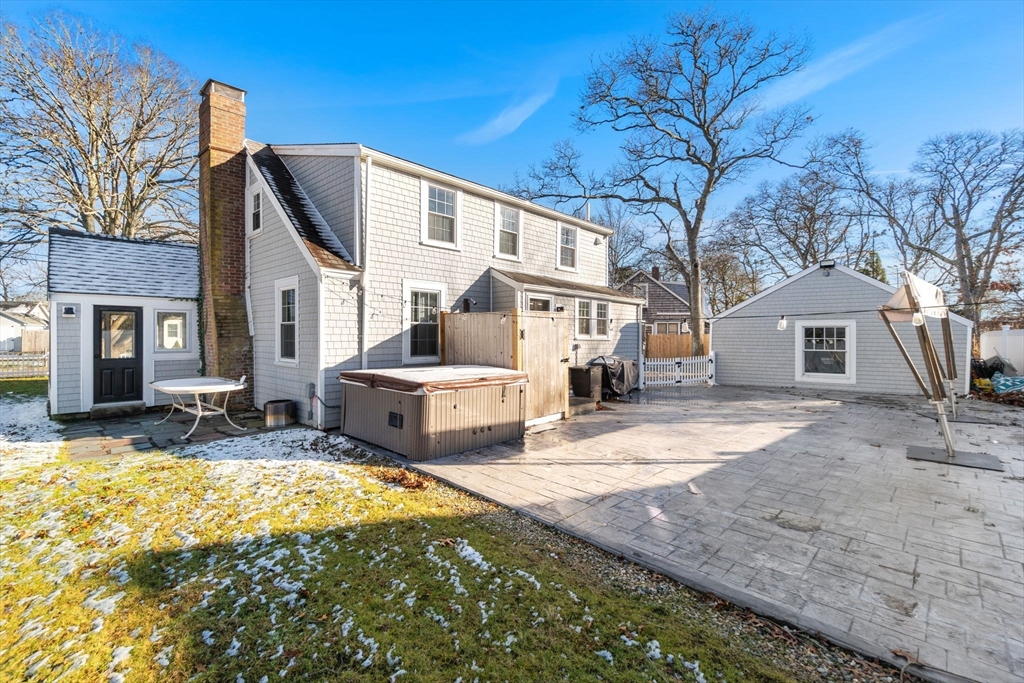 32 Woodside Avenue Wareham, MA 02532 - Photo 36 of 40 a view of a white house with a large tree in front of it