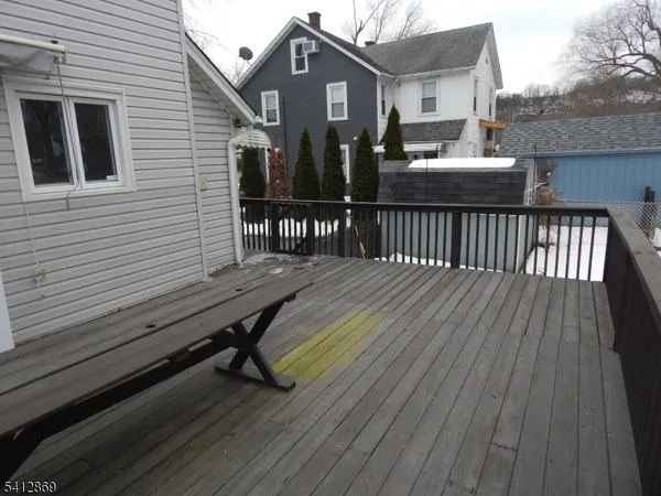 a view of a wooden chairs on deck