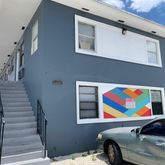 a room with stairs and furniture