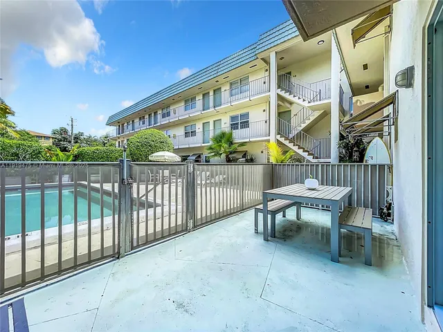 a view of a chair and table in the balcony