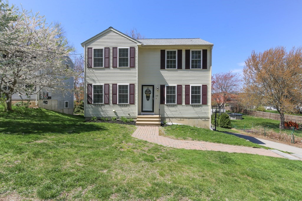 20 El Caney Road Worcester, MA 01603 - Photo 1 of 37 a front view of a house with a yard
