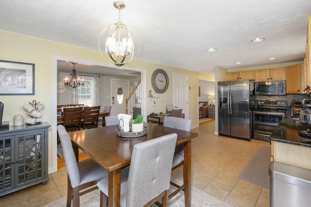 20 El Caney Road Worcester, MA 01603 - Photo 15 of 37 a view of a dining room with furniture and a chandelier
