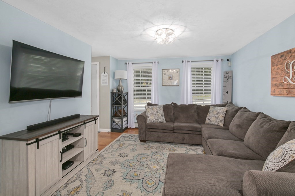 20 El Caney Road Worcester, MA 01603 - Photo 17 of 37 a living room with furniture and a flat screen tv