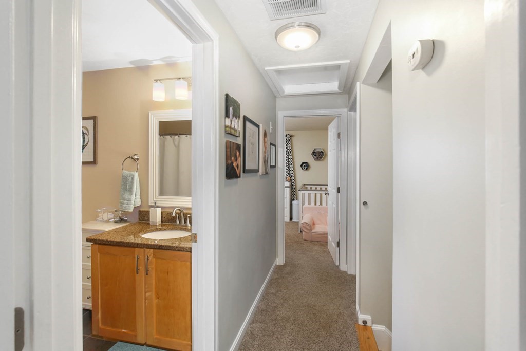 20 El Caney Road Worcester, MA 01603 - Photo 22 of 37 a view of a bathroom from the hallway