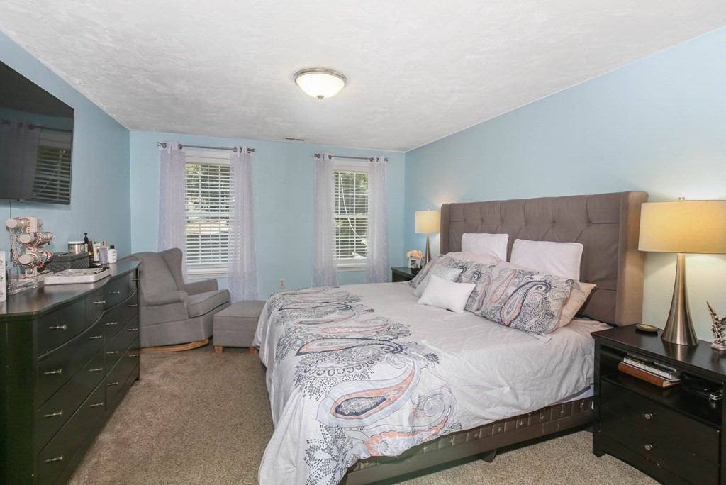 20 El Caney Road Worcester, MA 01603 - Photo 23 of 37 a bedroom with a bed and a couch