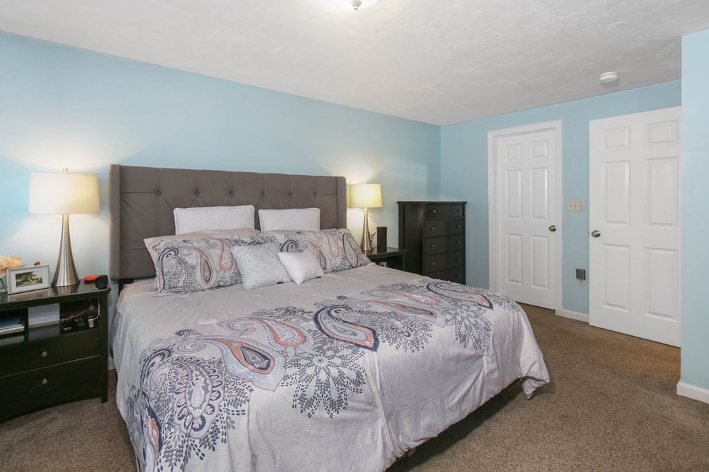 20 El Caney Road Worcester, MA 01603 - Photo 24 of 37 a bedroom with a bed and a night stand