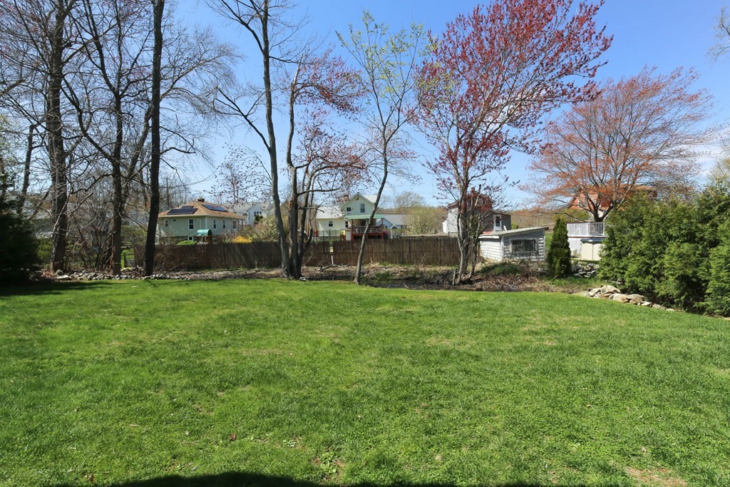 20 El Caney Road Worcester, MA 01603 - Photo 30 of 37 a view of a backyard with large trees