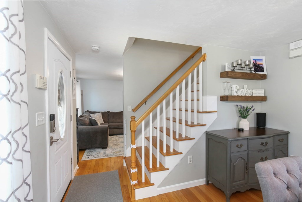 20 El Caney Road Worcester, MA 01603 - Photo 3 of 37 a view of entryway kitchen and hall with wooden floor