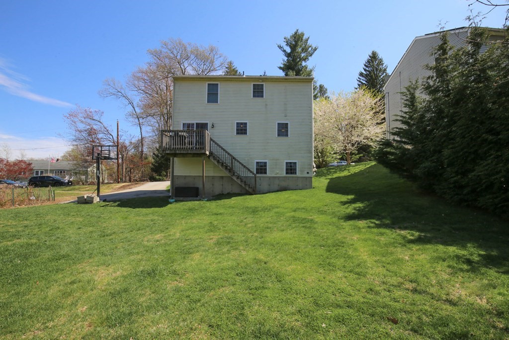 20 El Caney Road Worcester, MA 01603 - Photo 32 of 37 a view of a back yard of the house