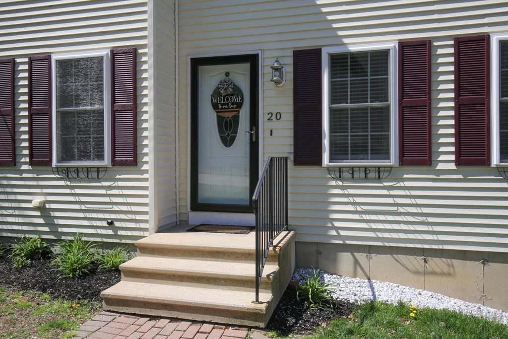 20 El Caney Road Worcester, MA 01603 - Photo 33 of 37 a front view of a house with a yard