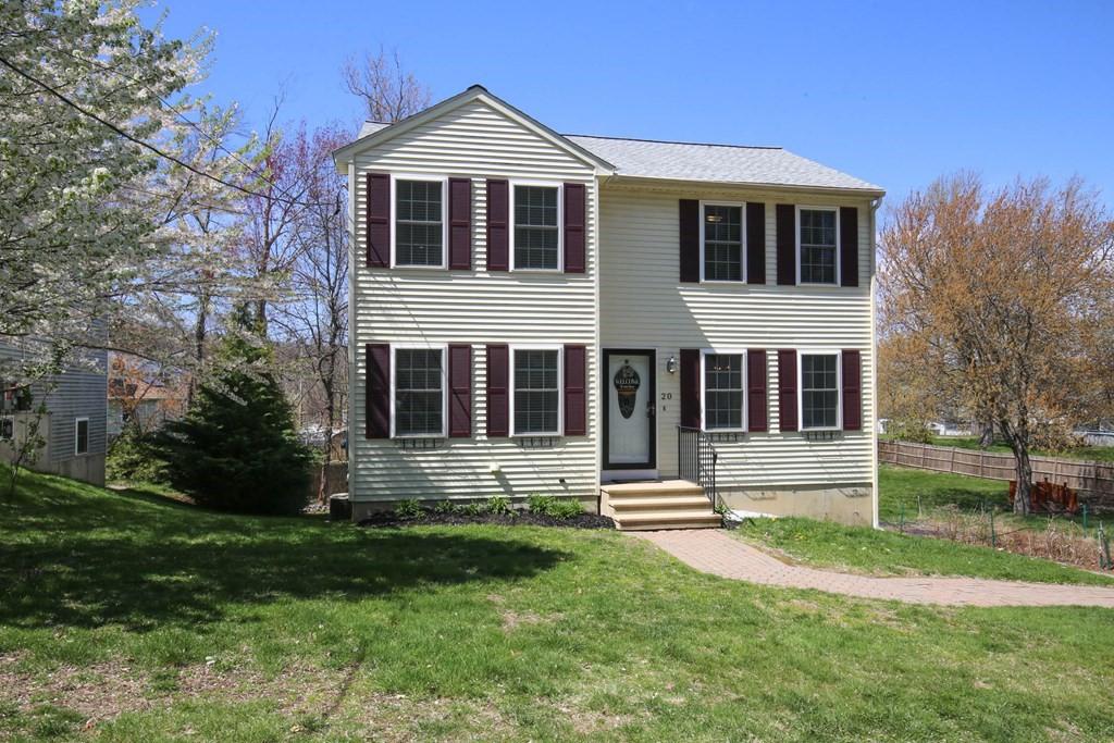 20 El Caney Road Worcester, MA 01603 - Photo 35 of 37 a front view of a house with a yard