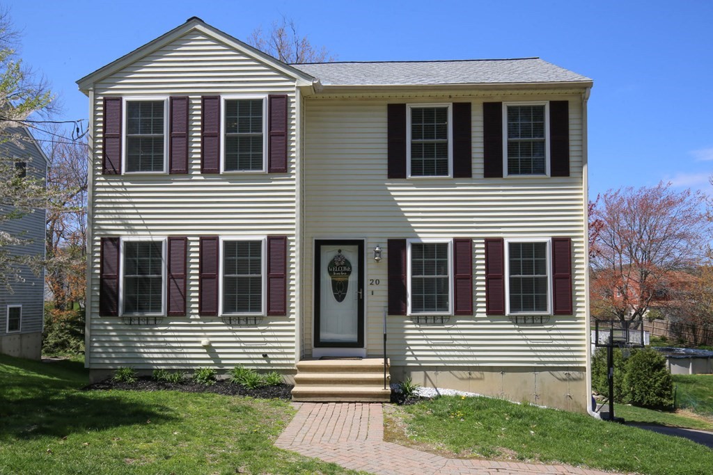 20 El Caney Road Worcester, MA 01603 - Photo 36 of 37 a front view of a house with a yard