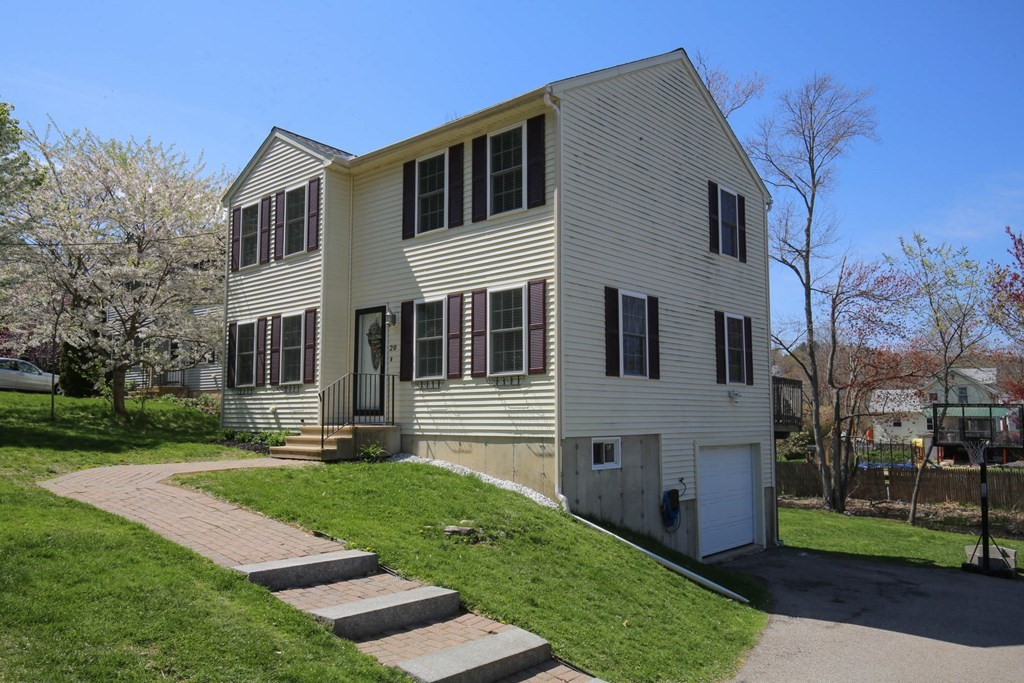 20 El Caney Road Worcester, MA 01603 - Photo 37 of 37 a front view of a house with a yard