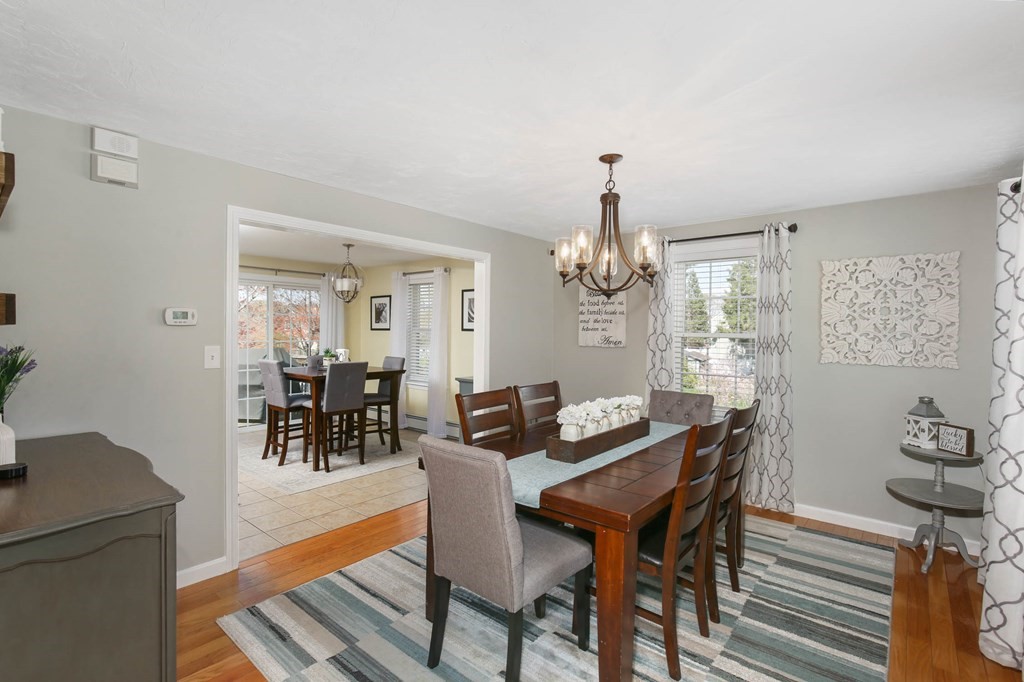 20 El Caney Road Worcester, MA 01603 - Photo 5 of 37 a view of a dining room with furniture and chandelier