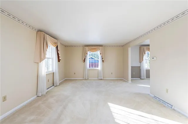 an empty room with windows