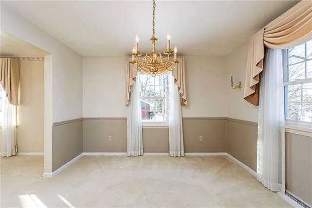 an empty room that has a window in it