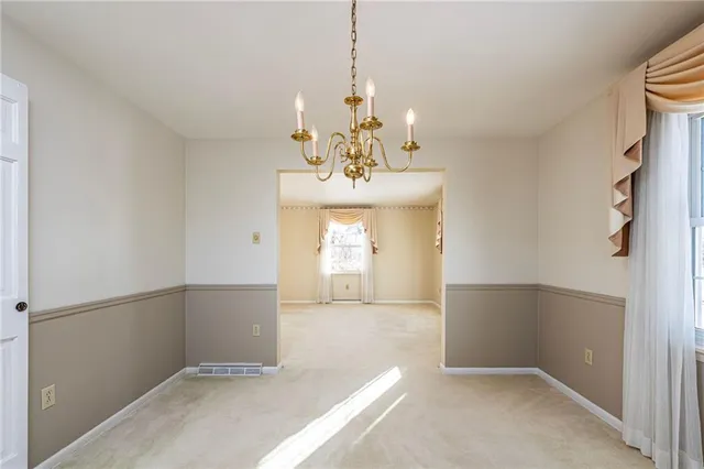 a view of a chandelier in a room with a chandelier