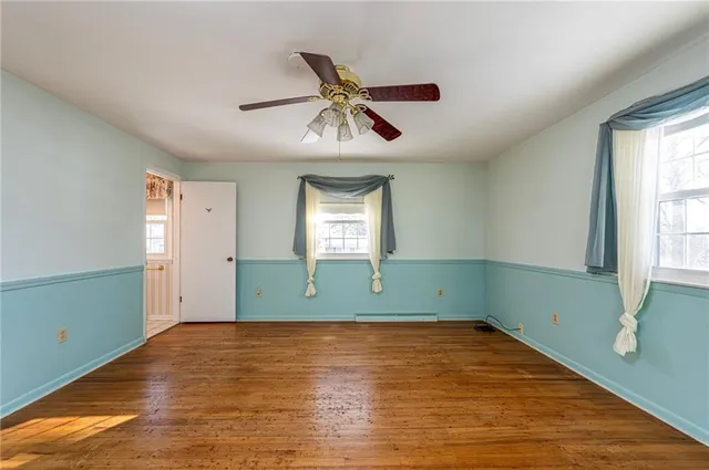 a view of room with window and ceiling fan
