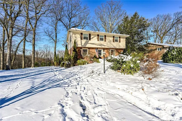 a view of a house with snow on the ground