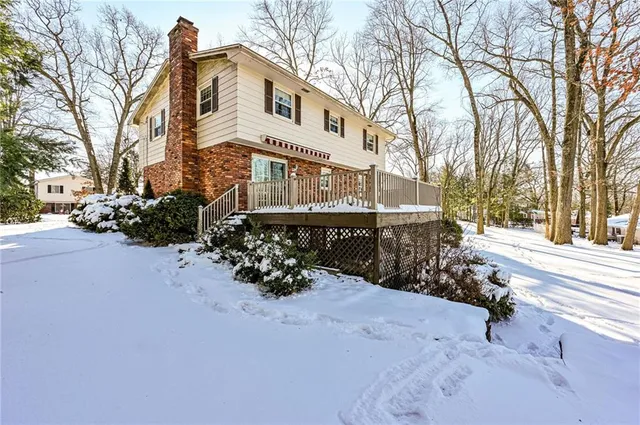 a view of a house with a snow in a yard