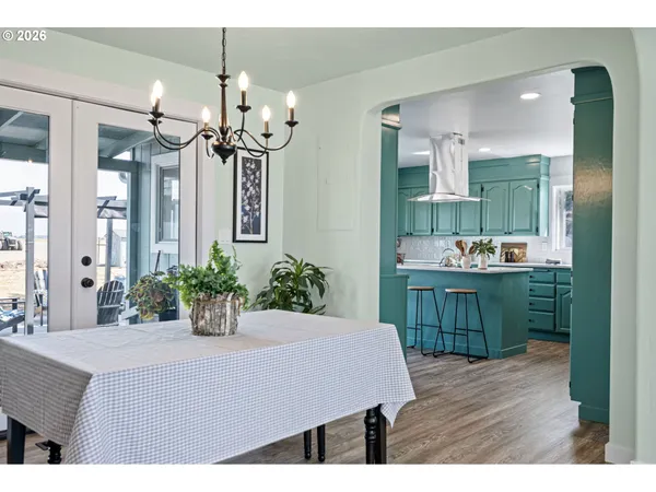 a kitchen view with kitchen island table and chairs