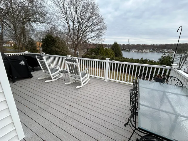 a view of a lake with houses in the back