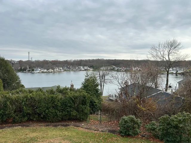 a view of a yard and front view of a house