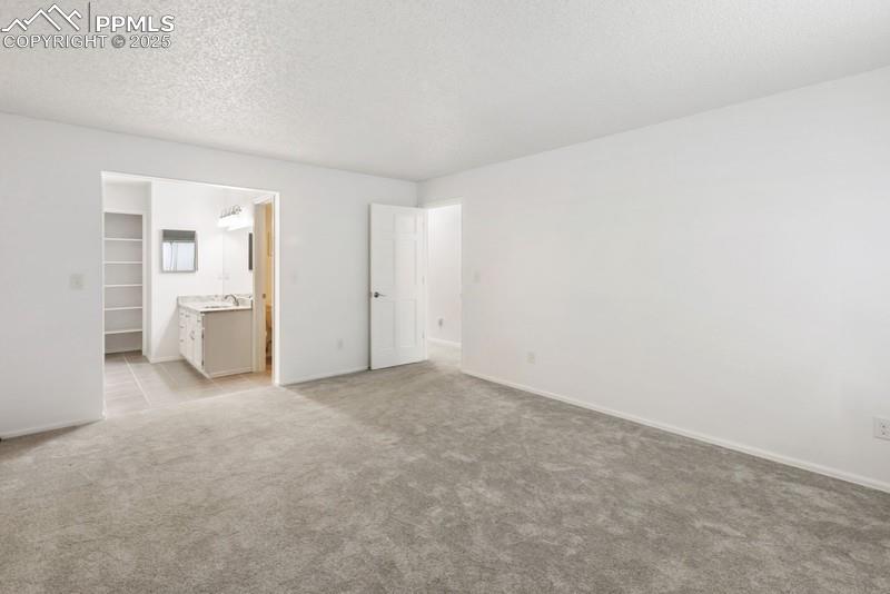 938 Fontmore Road, Unit B Colorado Springs, CO 80904 - Photo 11 of 30 an empty room with white walls and white walls