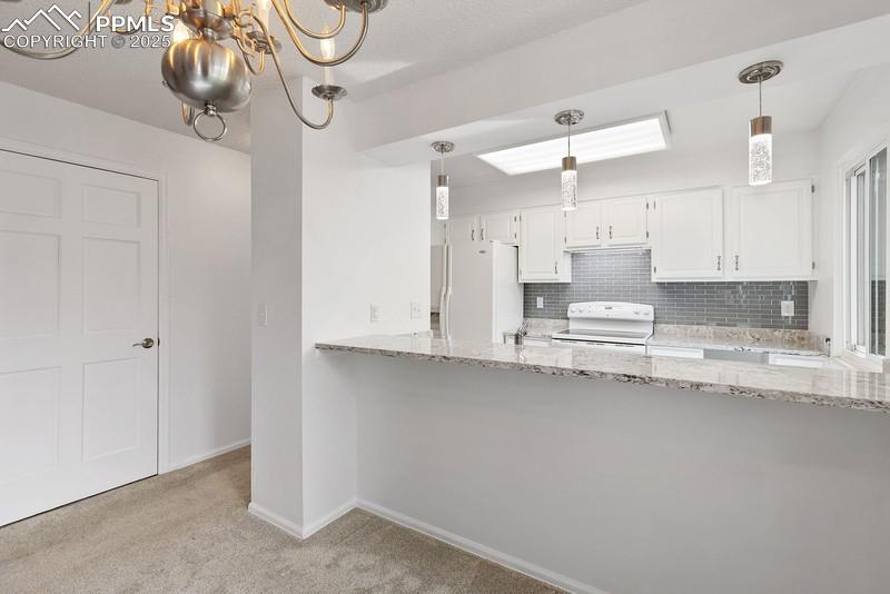 938 Fontmore Road, Unit B Colorado Springs, CO 80904 - Photo 16 of 30 a view of a kitchen with a sink and cabinets