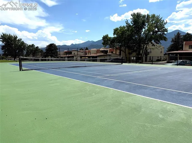 a view of outdoor space with playground and green space