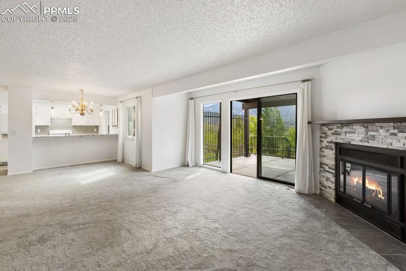 938 Fontmore Road, Unit B Colorado Springs, CO 80904 - Photo 7 of 30 a view of a kitchen with a sink and a fireplace
