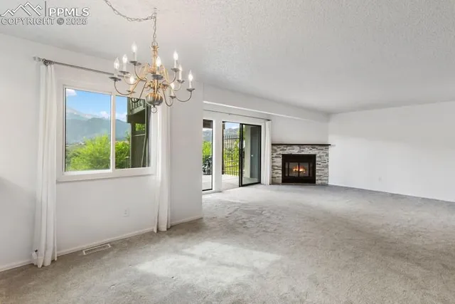 a view of livingroom with window and fireplace