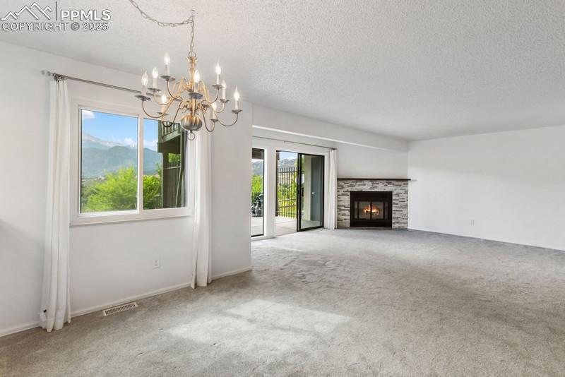 938 Fontmore Road, Unit B Colorado Springs, CO 80904 - Photo 9 of 30 a view of livingroom with window and fireplace