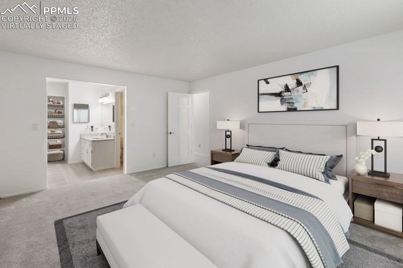 938 Fontmore Road, Unit B Colorado Springs, CO 80904 - Photo 10 of 30 a spacious bedroom with a bed and walk in closet