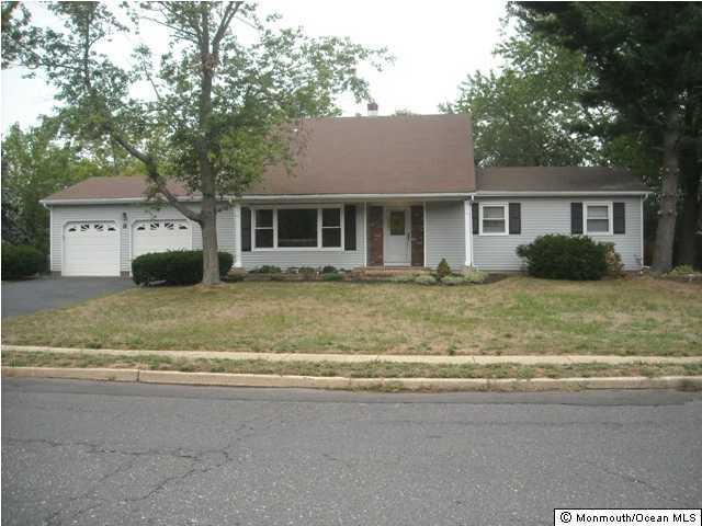 9 Newbury Road Howell, NJ 07731 - Photo 1 of 3 a house that has a tree in front of it