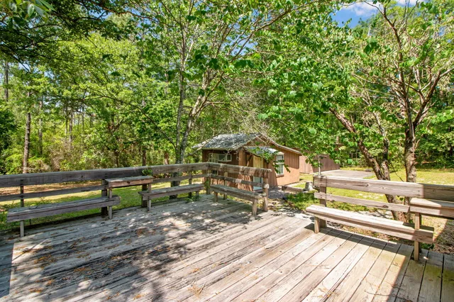 a view of a bench in a backyard