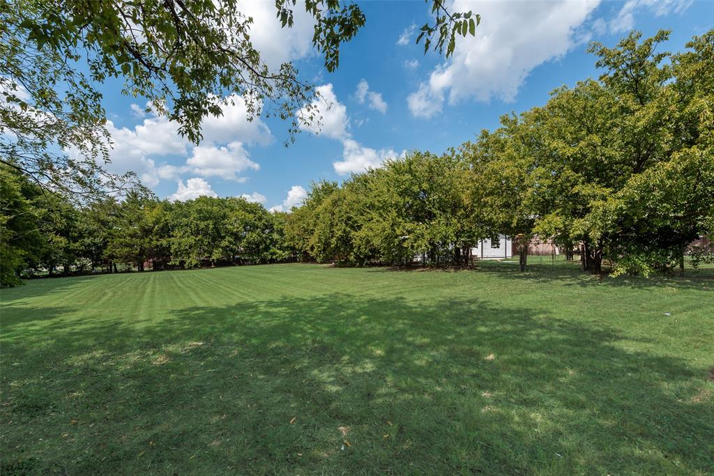 403 East Parkerville Road DeSoto, TX 75115 - Photo 6 of 6 a view of field with trees in the background