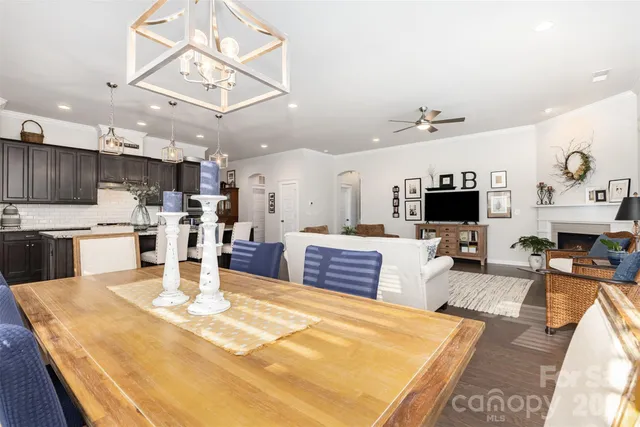 a large kitchen with a table and chairs