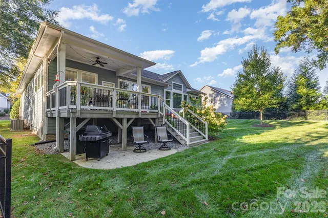 a view of a house with backyard porch and sitting area