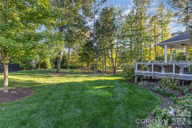 an aerial view of a house with yard swimming pool and outdoor seating