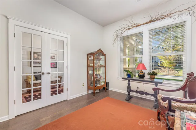 a view of a livingroom with furniture and windows